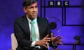 Rishi Sunak against a dark purple background in a BBC studio.