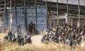 Riot police detain people at the Barrio Chino border crossing between Morocco and Melilla on 24 June 2022. Photograph: Javier Bernardo/AP