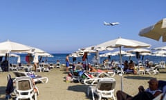 Plane flies over a beach in Cyprus