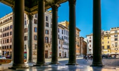 Sunny historic square seen through columns