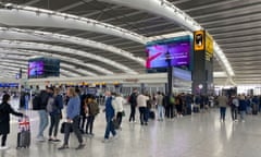 Passengers queue to go through security in departures at Terminal 5 of Heathrow airport in February 2023.