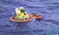 The Apollo 11 crew await pickup by the USS Hornet following a safe splashdown