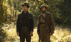 This image released by A24 shows Orion Lee, left, and and John Magaro in a scene from “First Cow.” Kelly Reichardt’s film led all films in nominations for the 30th annual Gotham Awards with four nods, including best film, best screenplay, best actor for Magaro and breakthrough actor for Lee. (A24 via AP)