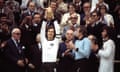 Franz Beckenbauer raises the World Cup trophy as West Germany teammates Sepp Maier and Paul Breitner look on following their 2-1 victory over the Netherlands in 1974