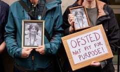Members of Parents against Ofsted hold photographs of Ruth Perry outside the Department for Education in London in March.