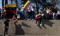 Venezuelan citizens gather near the Venezuelan consulate in Santiago, Chile, during the presidential elections.