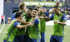 The Sounders celebrate as they head towards victory over the Timbers