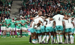 Ireland (left) and South Africa huddle before their Rugby World Cup meeting in Paris.
