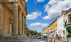 Centre of the Cotswold market town of Chipping Norton with the Town Hall to the left, Oxfordshire, England, UK