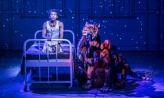 Hiran Abeysekera as Pi, with Richard Parker the tiger.