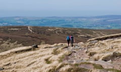 Two walkers on Kinder Scout, High Peak, in Derbyshire