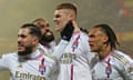 Jake O'Brien (centre) celebrates with teammates after scoring for Lyon against Lens last season. 