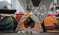 A pro-democracy protester uses her phone in her tent pitched under a bridge at the movement's main protest site in the Admiralty district of Hong Kong on December 2, 2014. The original founders of Hong Kong's pro-democracy Occupy movement tearfully announced on December 2 they would "surrender" by turning themselves in to police and urged protesters on the streets to retreat. AFP PHOTO / ANTHONY WALLACEANTHONY WALLACE/AFP/Getty Images