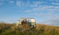 VW campervan against a blue sky