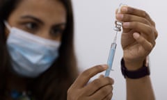  A woman draws the Astrazeneca vaccine as 