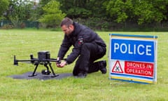 Police officer with a drone on the ground