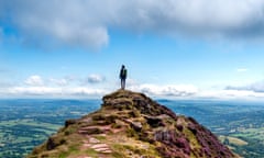 Young hiker on Black Hill, or cats back, in the Black Mountains looking at the view in the Brecon Beacons national park<br>GettyImages-1022905508