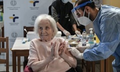 Elderly woman receives vaccine