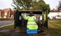 Man in hi-viz jacket at work on a junction box