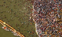 Thousands of Hindu devotees take dips at Sangam, the confluence of the Yamuna and the Ganges rivers, on Mauni Amavsya, the most auspicious day of Kumbh Mela.