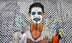 Egyptians walk past recent graffiti with modern and Pharaonic motifs in Mohammed Mahmoud Street near Tahrir Square, in downtown Cairo, Egypt, Wednesday, Sept. 17, 2014. Street art in Cairo, which flourished following the uprising that ousted former President Hosni Mubarak, has mostly been painted over by authorities, but on Mohammed Mahmoud street artists use the whitewashed walls for new art works. (AP Photo/Hassan Ammar)