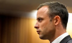 Oscar Pistorius stands in the dock during his trial in Pretoria in March 2014.