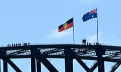 The Australian Aboriginal and Australian national flags are seen on top of the Sydney Harbour Bridge