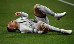 FBL-FRA-LIGUE1-MONTPELLIER-PSG<br>Paris Saint-Germain's French forward Kylian Mbappe lies on the ground after getting injured during the French L1 football match between Montpellier Herault SC and Paris Saint-Germain (PSG) at Stade de la Mosson in Montpellier, southern France on February 1, 2023. (Photo by Sylvain THOMAS / AFP) (Photo by SYLVAIN THOMAS/AFP via Getty Images)