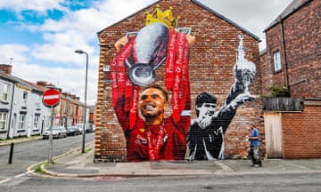 Jordan Henderson lifting the Premier League trophy, with Alan Hansen lifting the old Division One trophy