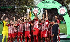 Kostas Fortounis of Olympiakos lifts the Europa Conference League trophy