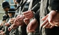 Line of british police officers are handcuffed together