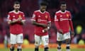 Fred (centre) alongside Manchester United teammates Bruno Fernandes (left) and Anthony Elanga