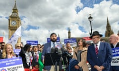 Monty Panesar (centre) and George Galloway (wearing hat on right) campaigning outside parliament on Tuesday