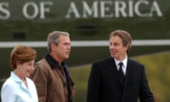 President George W Bush and Laura Bush greet Tony Blair on his arrival at the Bush ranch on 5 April 2002.