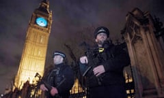 London New Year 2016epa05084769 Armed police officers stand outside of The Queen Elizabeth Tower and The Houses of Parliament in London ahead of the New Years Eve fireworks in, London, Britain, 31 December 2015. Police have increased security for London's New Year's Eve celebrations amid fears of a mass terrorist attack in the capital. EPA/HANNAH MCKAY