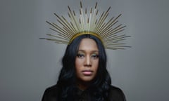 VV Brown wearing a metal headdress.