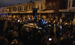 Protests in Philadelphia<br>A protester stands on a vehicle as demonstrators clash with riot police during a rally after the death of Walter Wallace Jr., a Black man who was shot by police in Philadelphia, Pennsylvania, U.S., October 27, 2020. Picture taken October 27, 2020. REUTERS/Yuki Iwamura