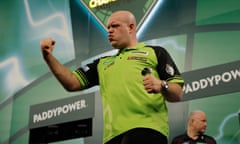 Michael van Gerwen celebrates his victory over Keane Barry in round two of the 2023/24 PDC World Darts Championship.