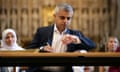 Sadiq Khan signs the declaration of acceptance of the mayoralty at a service in Southwark Cathedral.