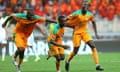 Nicolas Pépé (r) celebrates after sealing victory for the Ivorians.