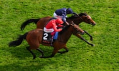 Tuesday (top) holds off Emily Upjohn at the line in the Oaks.