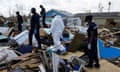 FILE PHOTO: Police officers search for the dead in the destroyed Mudd neighborhood after Hurricane Dorian hit the Abaco Islands in Marsh Harbour, Bahamas, September 10, 2019. REUTERS/Marco Bello/File Photo