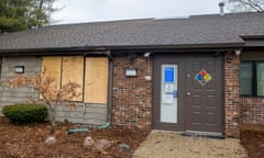 A front window is boarded up at the Planned Parenthood in Peoria, Illinois, in January, following the fire. 