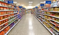 Early morning view of Tesco UK supermarket shopping aisle