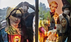 Boys peep through the glass of a church in Gauhati, India, at Christmas, 2020.