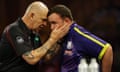 Referee Russ Bray comforts Luke Littler during the world darts final