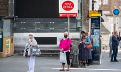 People queueing for a branch of the Post Office near London Bridge, London