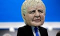 A masked actor portraying Boris Johnson in the Oxfam Big Heads event at the UN Climate Change Conference COP25 in Madrid.