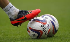 Detail of footballer's boot and football