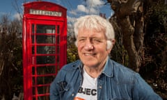 Paul with his red phone box in the garden of his home.